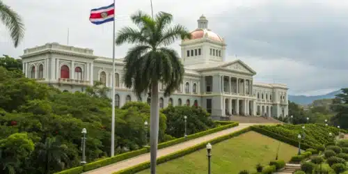Realistic view of a Costa Rican legislative building with official documents on Costa Rica Laws on Weed.